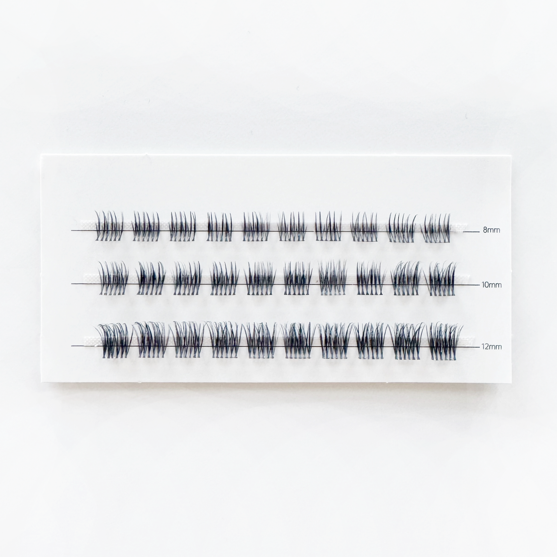 Kasha Lashes sectional lash clusters with invisible band. Pre-cut, ready-to-wear lashes for a natural or bold look.